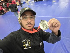 Jeriel Carmenaty-Ortiz taking a selfie with his silver medal. He says, "This will forever be one of the most sentimental memories of my life. "
